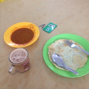Pek Nga Nyok (coconut pancake) with gulai and Malaysians' famous teh tarik. these for rm5.